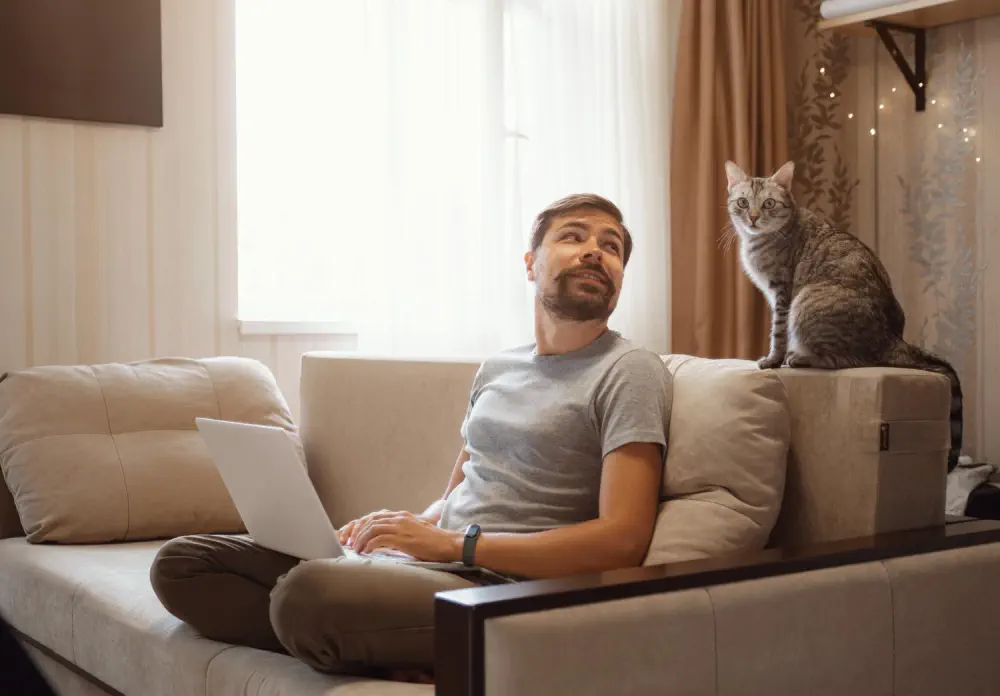 Man on a sofa, representing the comfort of private detox rooms.