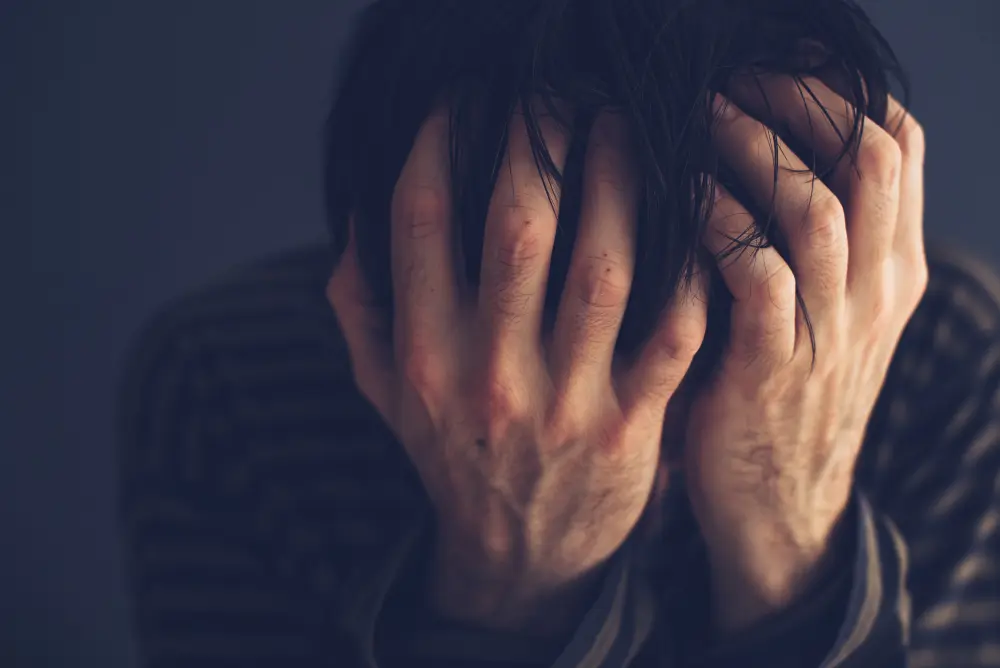 hopeless-drug-addict-holding-his-head-2021-08-26-23-02-52-utc Cocaine Effects: What Does Cocaine Do To Your Mind and Body?