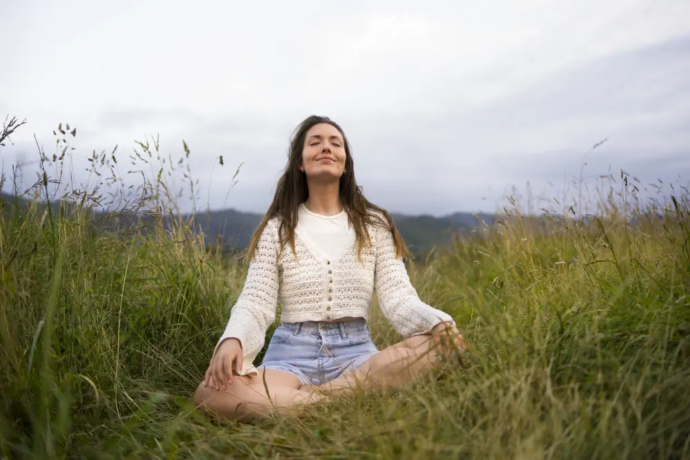 front-view-smiley-woman-meditating-outdoors What Makes Fentanyl Addictive?