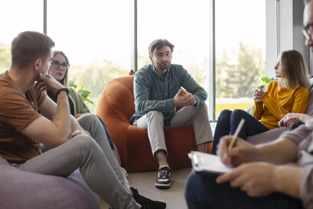 people-attending-therapy-meeting How to Detox from Weed: A Practical Guide