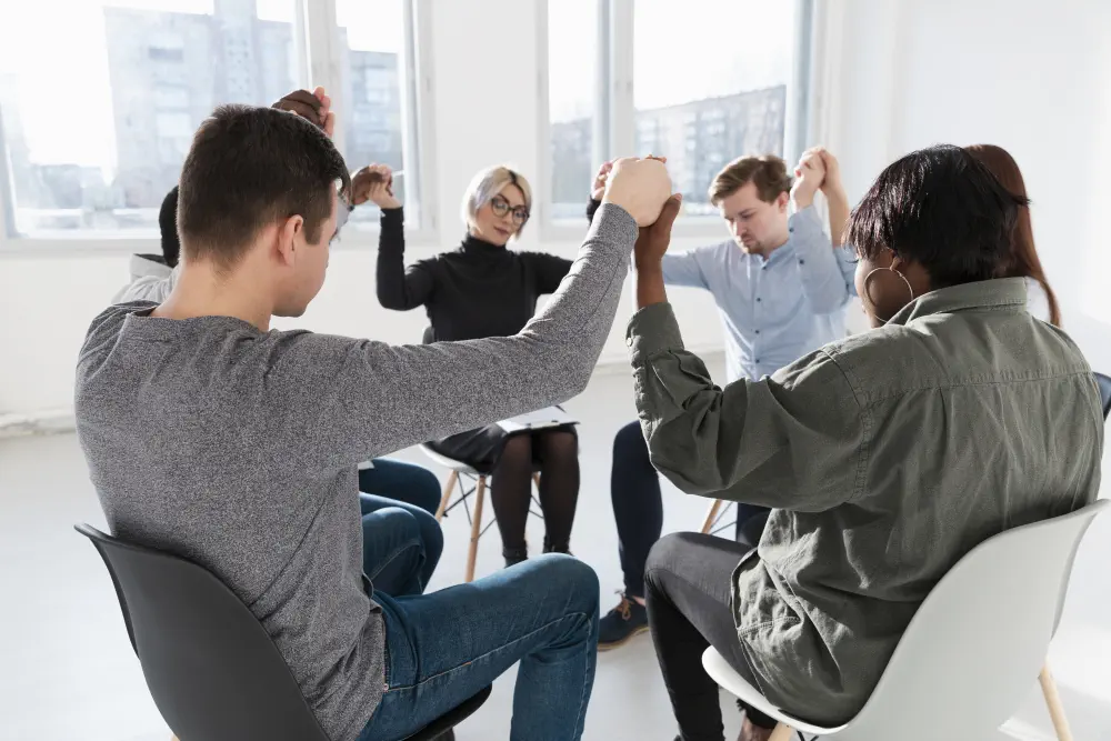 people-standing-with-closed-eyes-raising-hands What are the Most Effective Treatments for Adderall Addiction?
