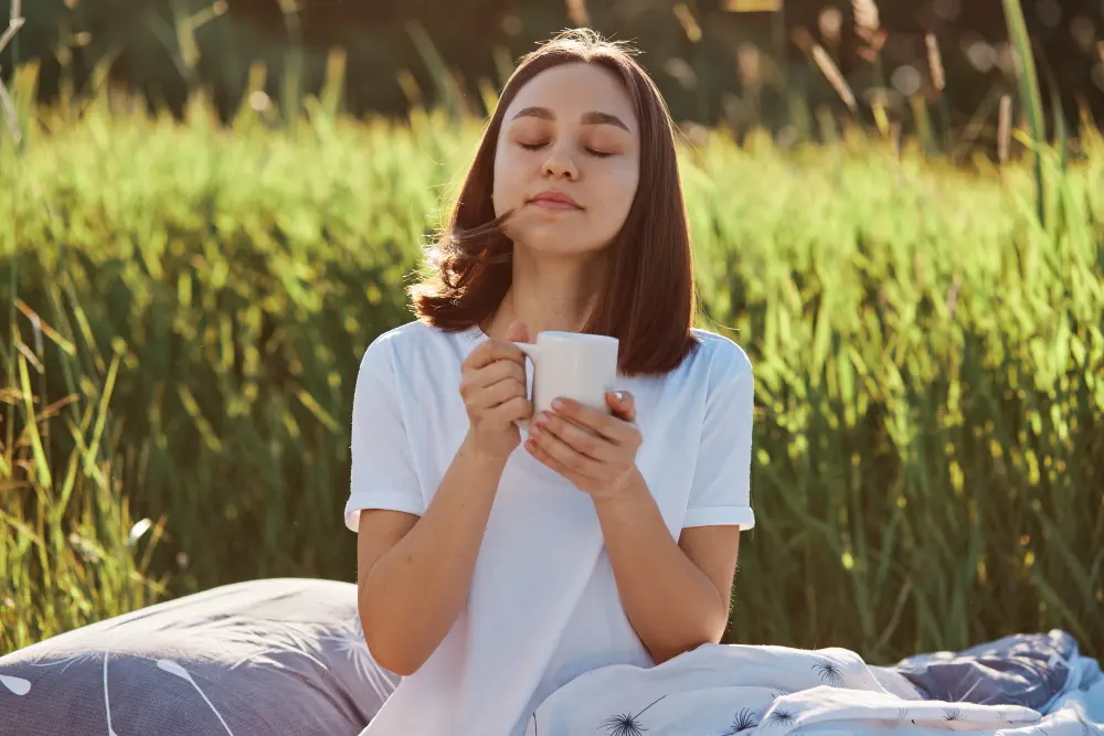 relaxed-dark-haired-female-wearing-white-casual-style-t-shirt-posing-outdoor-with-cup-hot-tea-coffee Effective Interventions for Drug and Alcohol Abuse Recovery