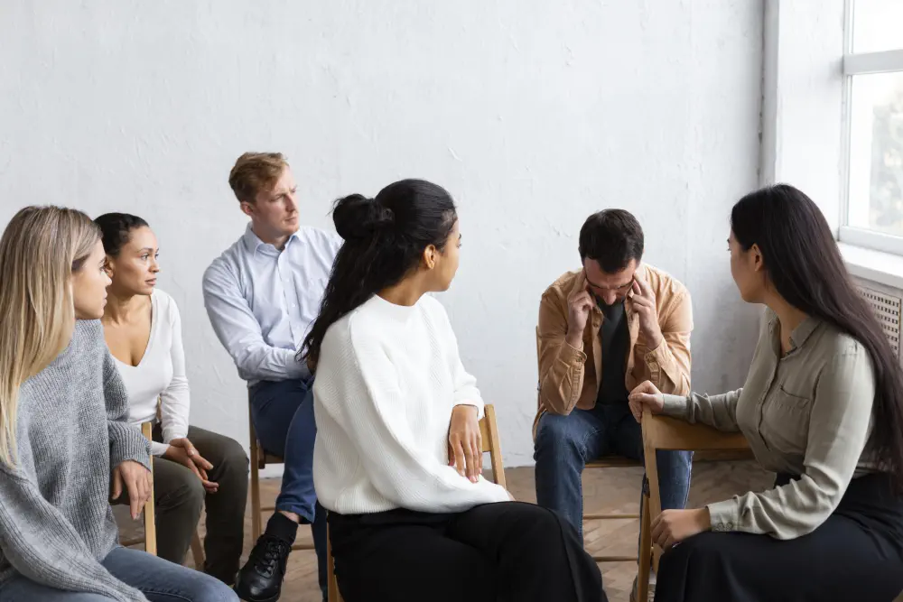 sad-man-talking-about-his-issues-group-therapy-session What are the Most Effective Treatments for Adderall Addiction?