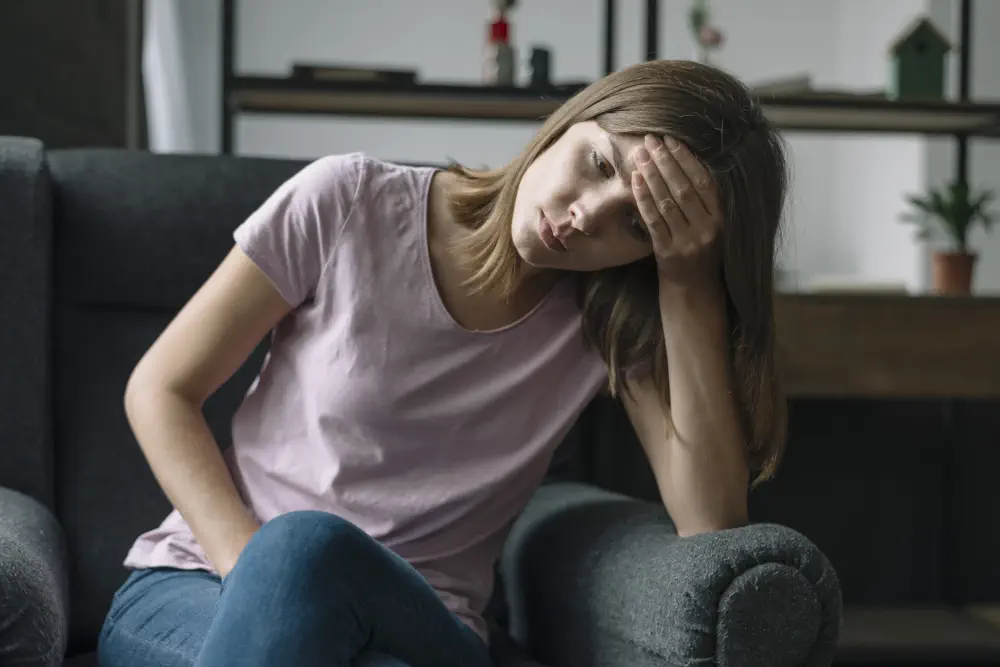 unhappy-young-woman-sitting-armchair How Addictive is Ketamine? Unveiling the Hidden Dangers