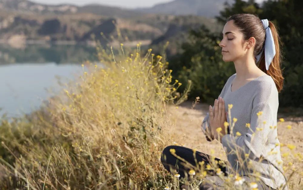 young-woman-meditating-nature Is Drug Addiction a Mental Illness?