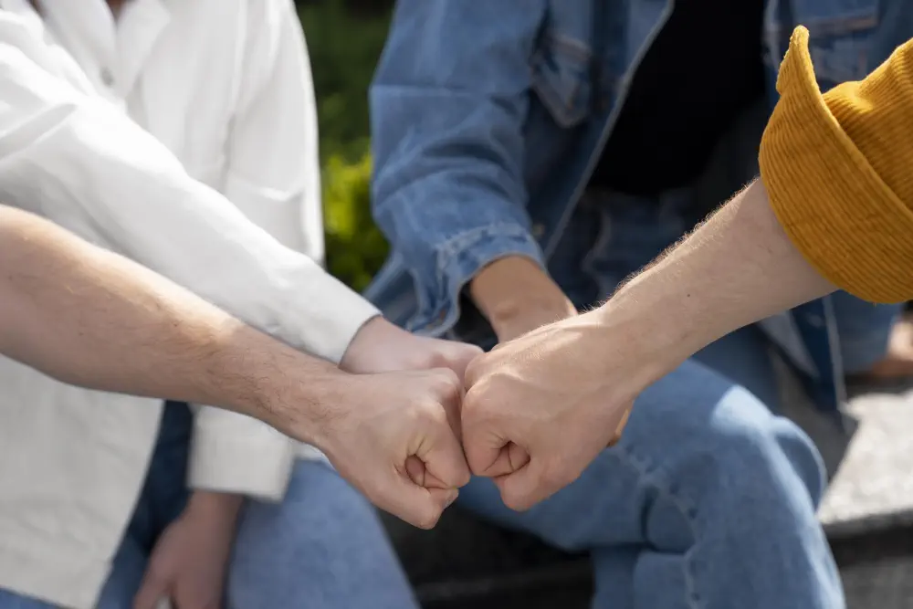 close-up-friends-fist-bumping How to Quit Drinking Alcohol: Effective Ways to Help Someone Stop