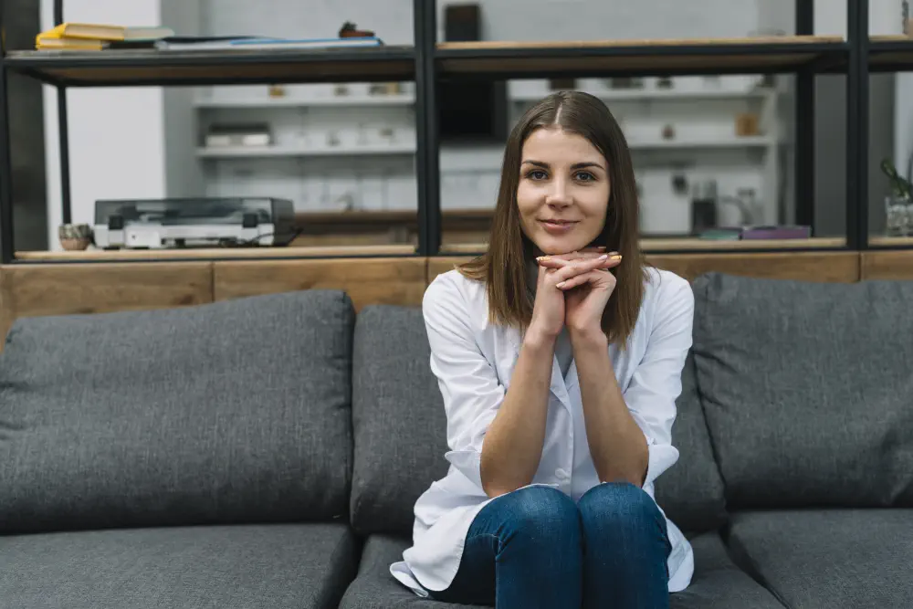 portrait-female-physician-sitting-gray-sofa-with-hand-clasped How to Help a Drug Addict Who Doesn't Want Help? Effective Advice