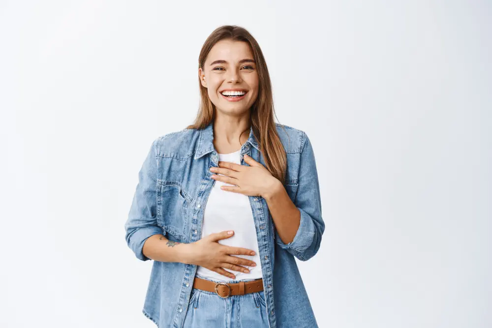 beautiful-young-woman-laughing-having-fun-chuckle-while-holding-hands-chest-smiling-white-teeth-express-happiness-positive-emotions-white Top 11 Best Foods To Eat For a Healthy Liver