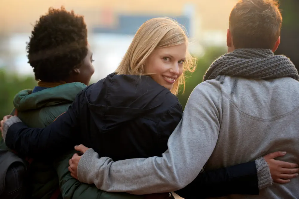 college-friends-portrait-with-hug-outdoor-bonding-relax-break-campus-with-diversity-university-people-smile-with-embrace-support-education-learning-fun-with-rear-view How Much Does Sober Living Cost for Luxury Centres in Cobourg?