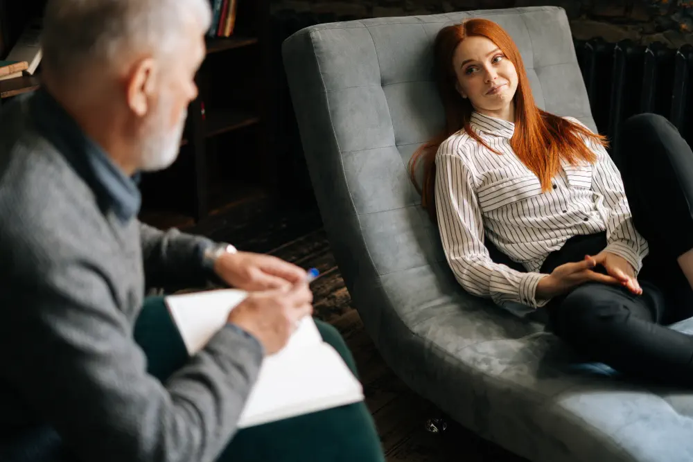 happy-attractive-redhead-young-woman-patient-is-telling-about-her-mental-health-while-lying-comfortable-sofa-psychological-consultation-concept-psychological-treatment Signs of Porn Addiction: What You Need to Know