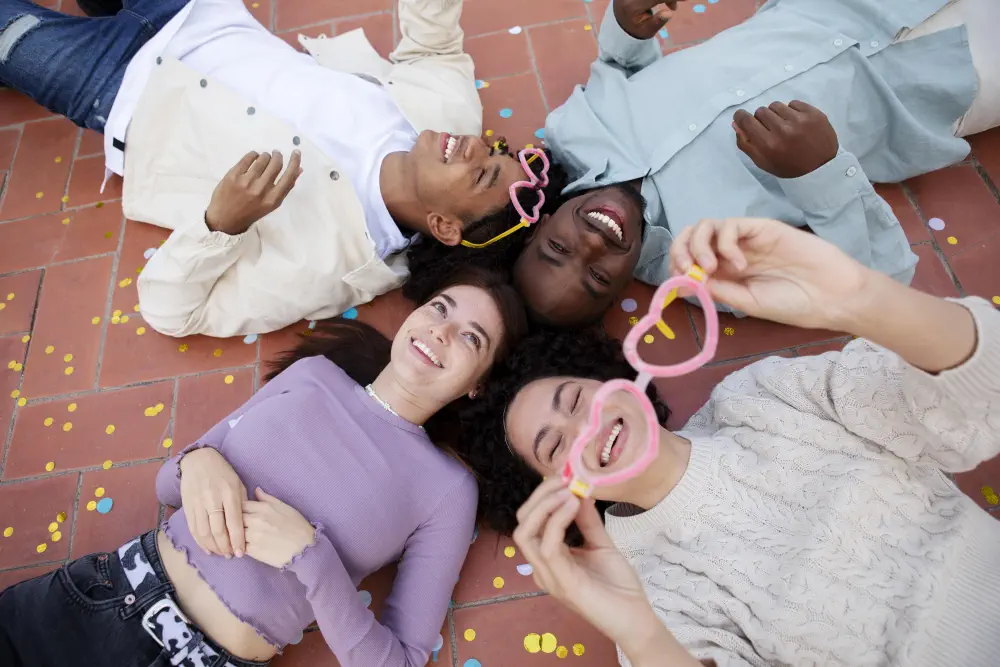 medium-shot-friends-sitting-floor Am I Addicted to Marijuana? The Test Will Show