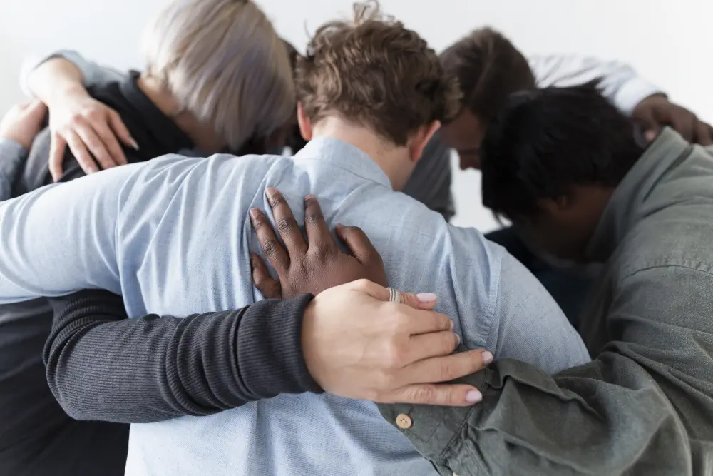 people-forming-circle-embracing What Are Some Common Slang Terms for Cocaine?