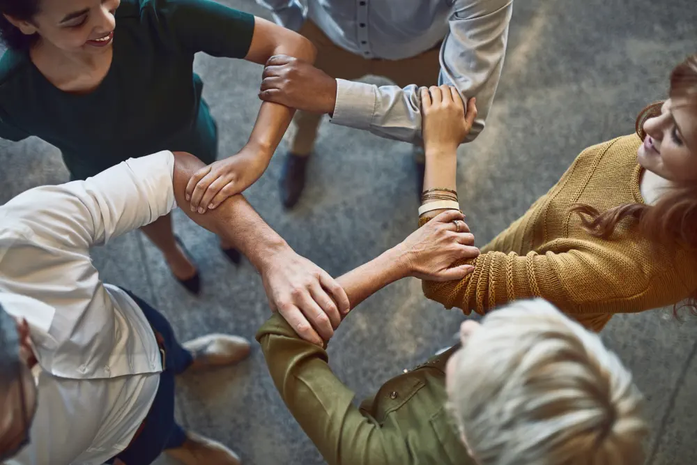successful-business-is-strong-team-high-angle-shot-group-colleagues-linking-arms-solidarity-work What Are Some Common Slang Terms for Cocaine?