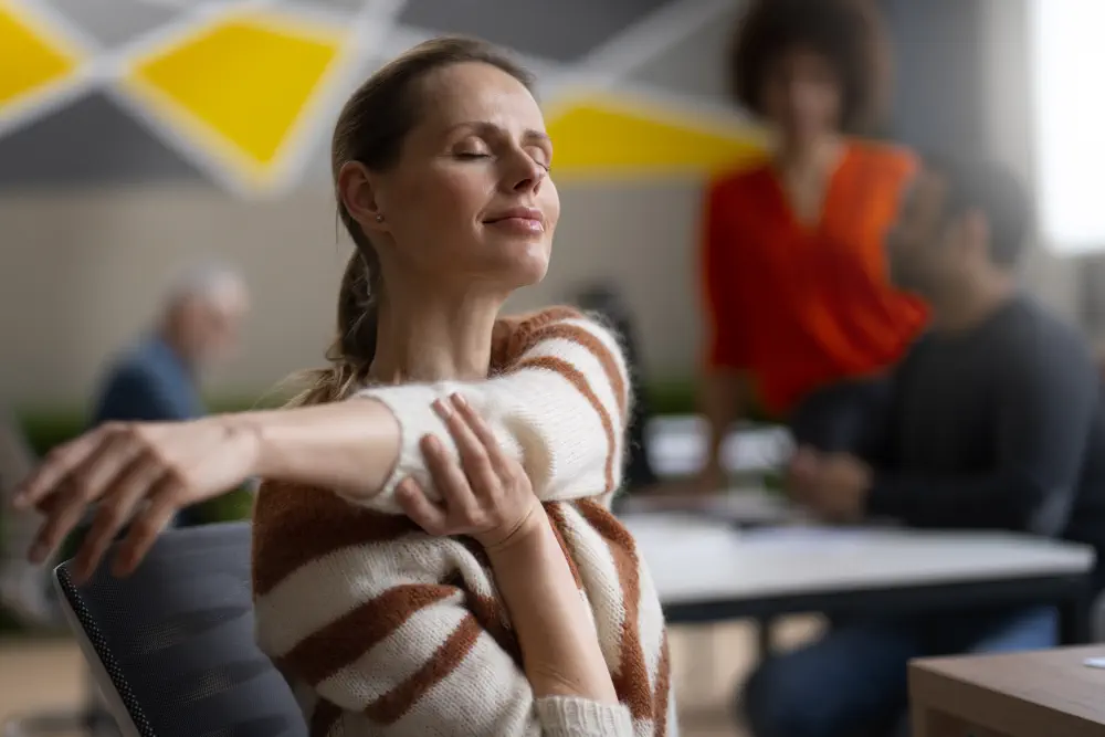 woman-office-stretching-work-day How Unhealthy is Weed for Mental Health?