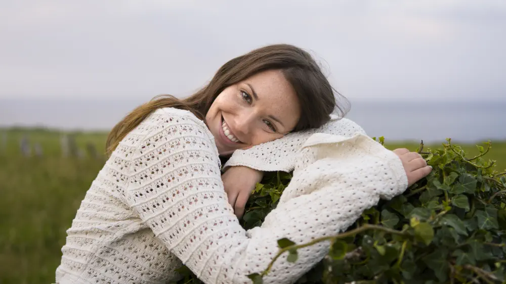 medium-shot-smiley-woman-posing-outside What Are the Symptoms of Drug-Induced Psychosis?