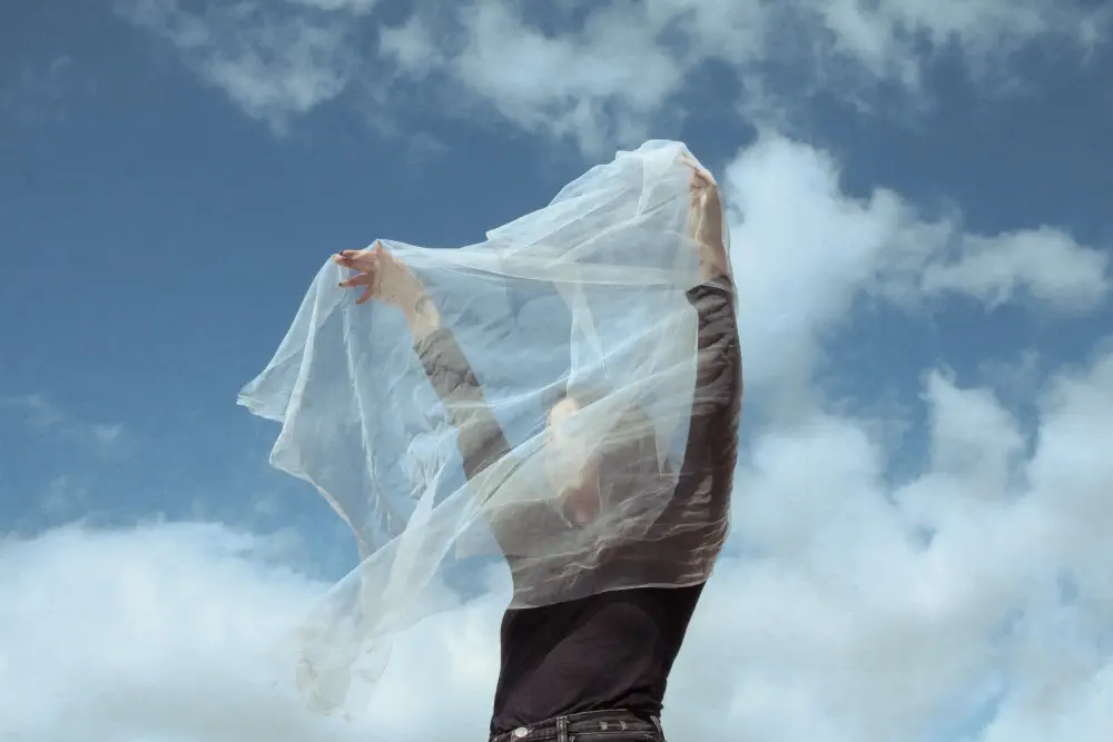 woman-holding-white-textile-while-standing-against-cloudy-sky Why Gabapentin Ruined My Life?
