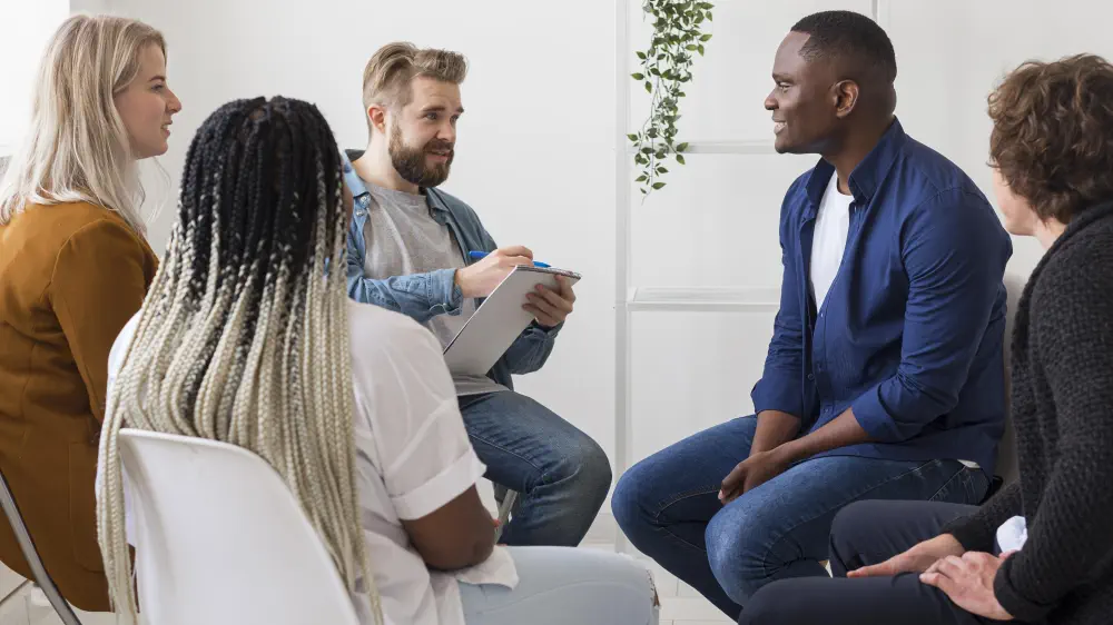 medium-shot-man-writing-clipboard How Does Gestalt Therapy Help With Addiction?