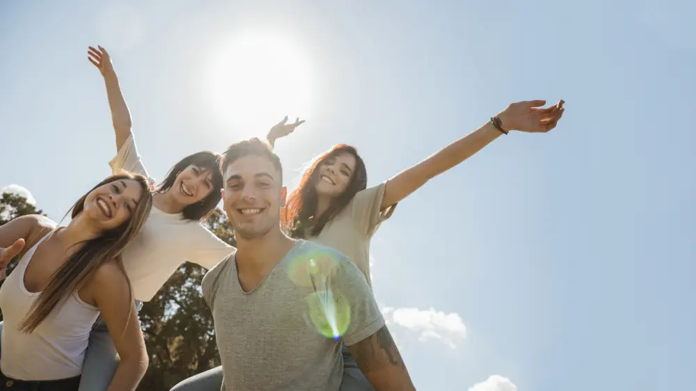 group-friends-raising-arms-sky-background Understanding Salvia Addiction: Risks, Symptoms, and Treatment