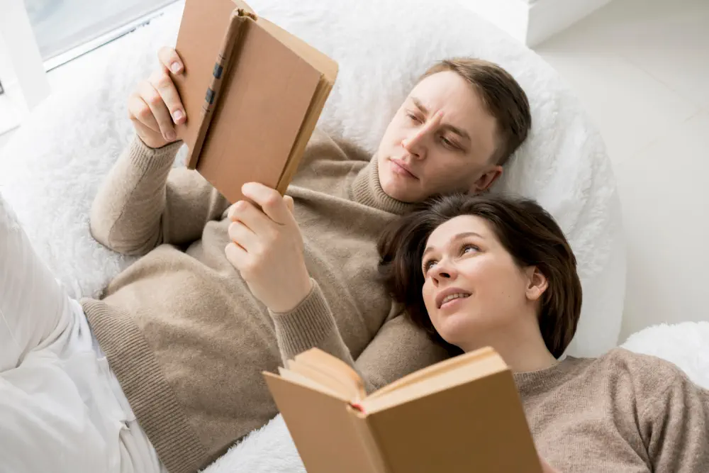 Couple reading in beanbag chairs.