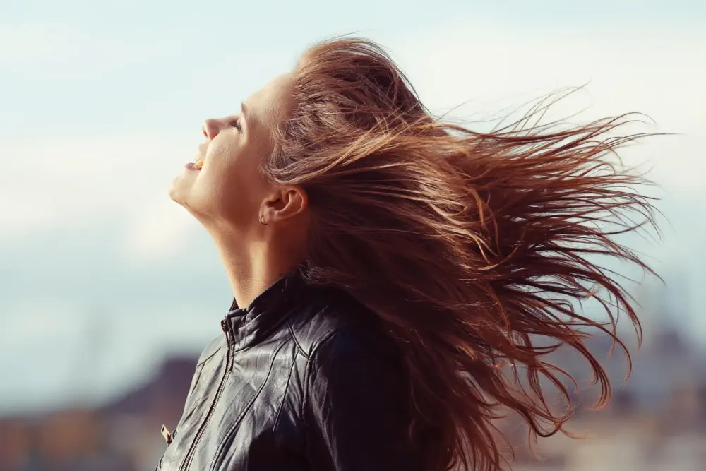 Woman with windblow hair.