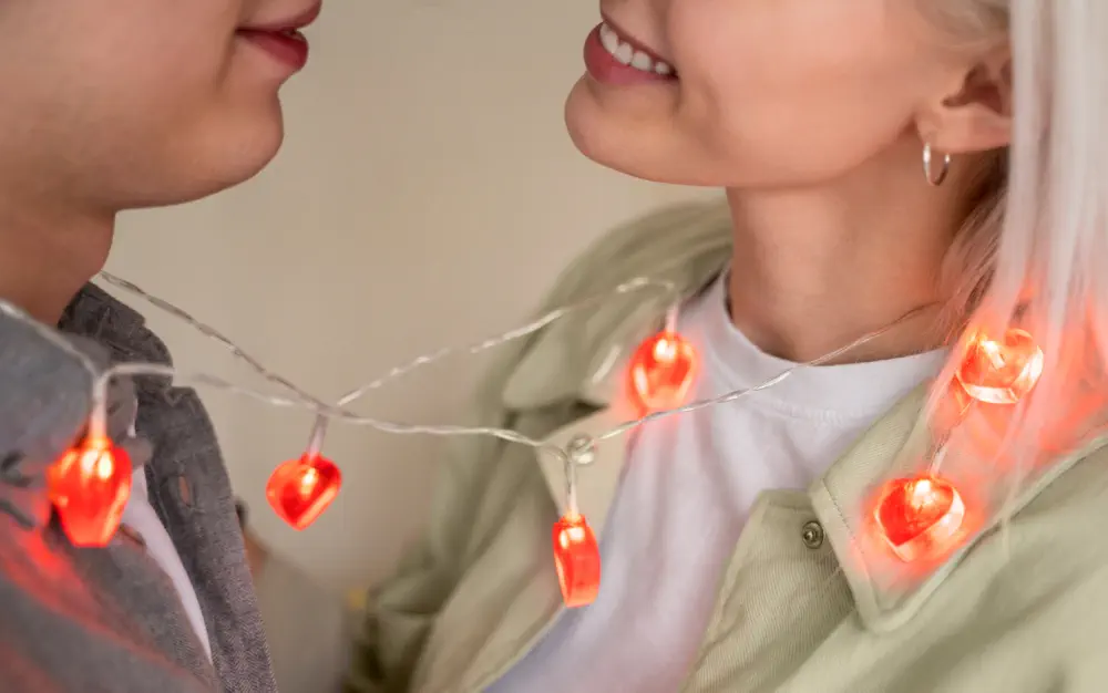 Couple linked by lights, reflecting love addiction.